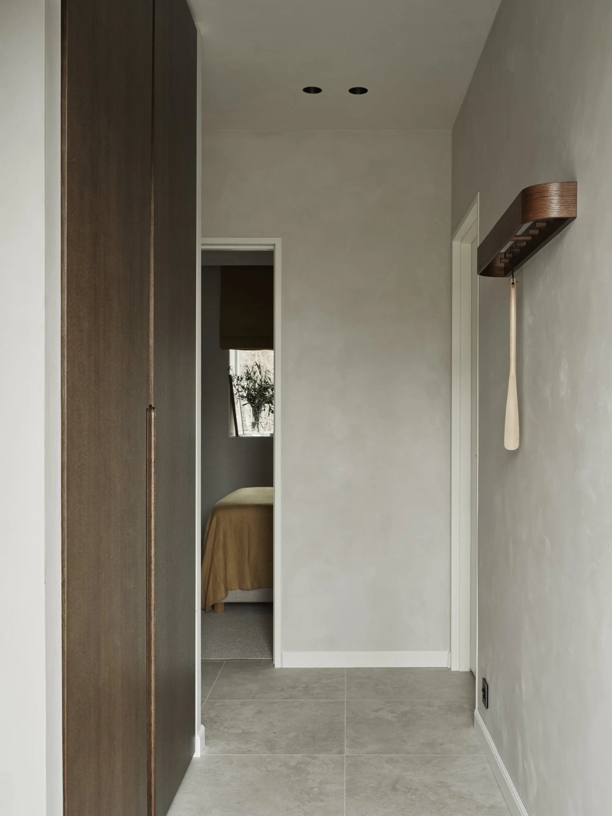 Neutral-toned hallway with natural stone tiles