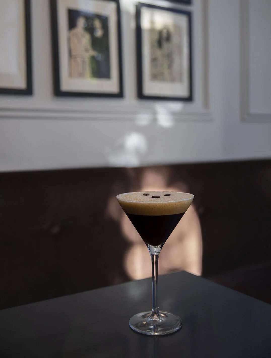 Espresso martini in moody lighting at Locals café.