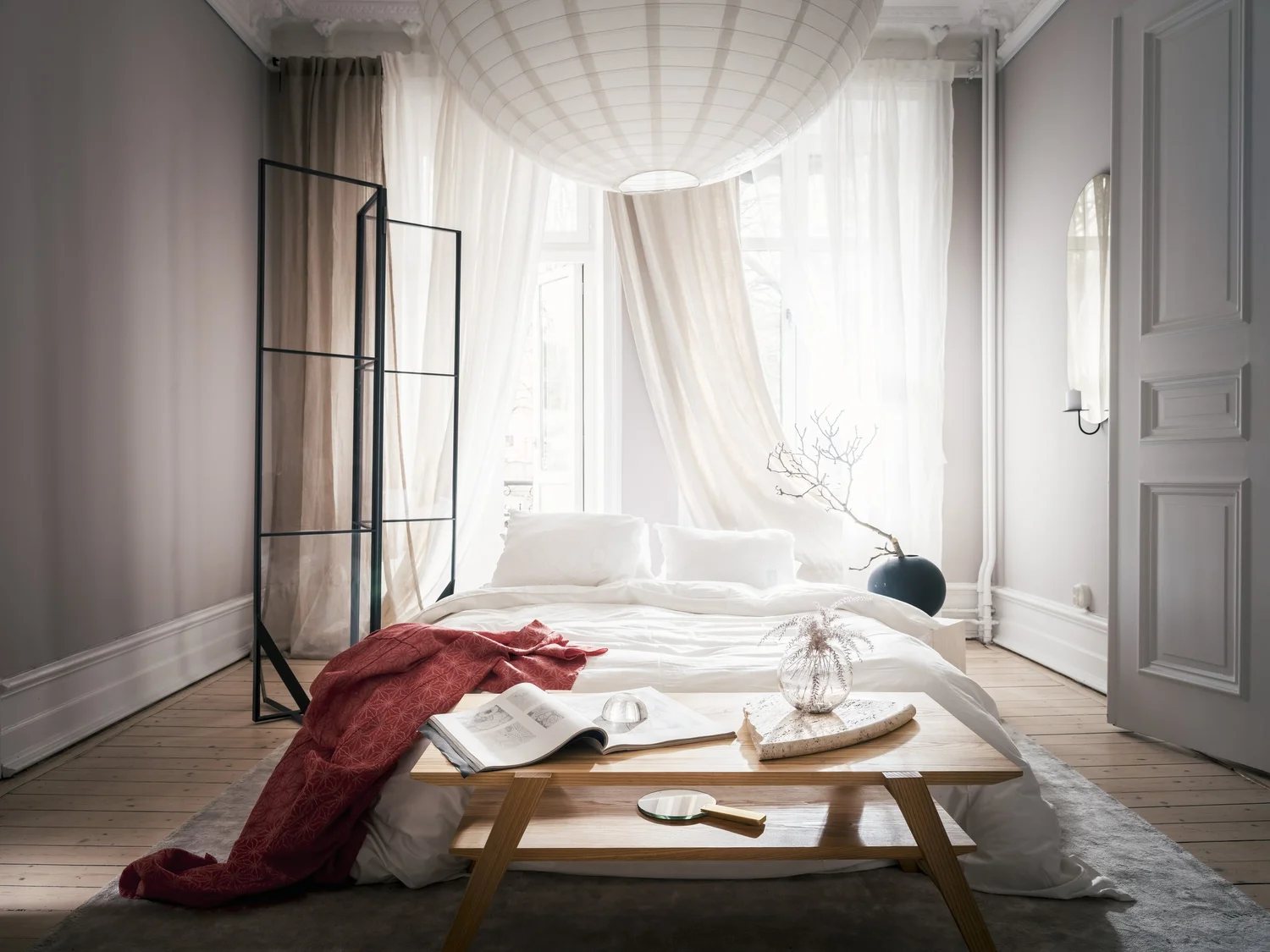 Neutral-toned bedroom with organic forms and soft layering.